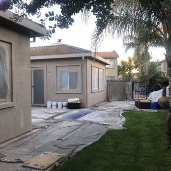 Marc Parham Painting - Portion of back patio before with primer - Painters Near Me - Vacaville, California Marc Parham Painting - Portion of back patio before with primer - Painters Near Me - Vacaville, California