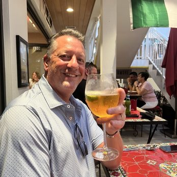 Pane E Amore Italian Cafe - My cute husband drinking beer from a wine glass - Cafes Near Me - Bradenton Beach, Florida