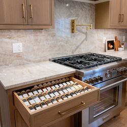 Laslo Custom Kitchens - Custom cabinetry with a spice drawer.