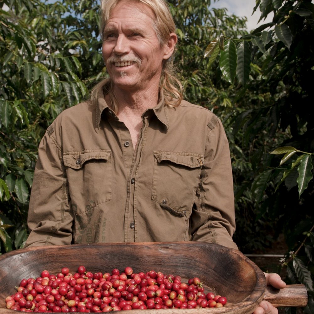 Maui Estate Coffee - a man holding a bowl of coffee cherries - Coffee & Tea Near Me - Kula, Hawaii