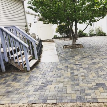 Honest Landscaping Solutions - a paver patio with steps leading up to a tree - Landscaping Near Me - West Jordan, Utah Honest Landscaping Solutions - a paver patio with steps leading up to a tree - Landscaping Near Me - West Jordan, Utah