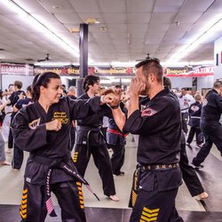Ultimate Leadership Martial Arts Cincinnati - Owners Michael & Jennifer Mershad in a training seminar!