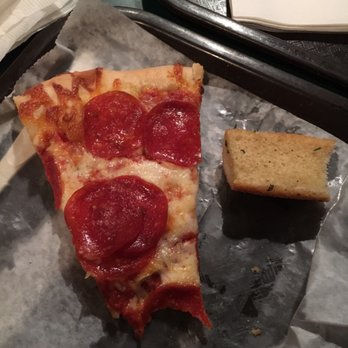 Cossetta Alimentari - Pepperoni pizza slice and a breadstick, both a little greasy - Italian Near Me - Saint Paul, Minnesota
