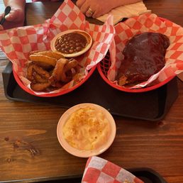BBQ Ribs - Half Slab, mac and cheese, baked beans, and onion rings! BBQ Ribs - Half Slab, mac and cheese, baked beans, and onion rings!