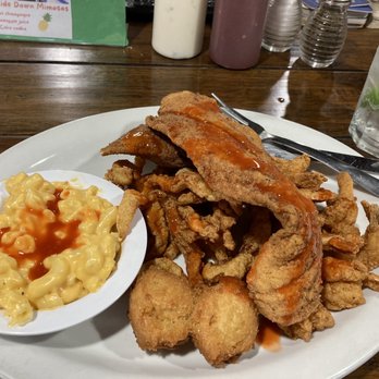 Jinright's Seafood House - 'Mates' with Mac and cheese. Topped with hot sauce. - Seafood Near Me - Brunswick, Georgia Jinright's Seafood House - 'Mates' with Mac and cheese. Topped with hot sauce. - Seafood Near Me - Brunswick, Georgia