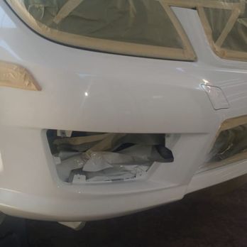 Jackie's Auto Care - White car front right bumper after repair and repainting - Auto Repair Near Me Jackie's Auto Care - White car front right bumper after repair and repainting - Auto Repair Near Me