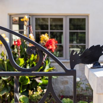 Lynch Construction - a wrought iron gate with a bird on it - General Contractors Near Me - Santa Barbara, California Lynch Construction - a wrought iron gate with a bird on it - General Contractors Near Me - Santa Barbara, California