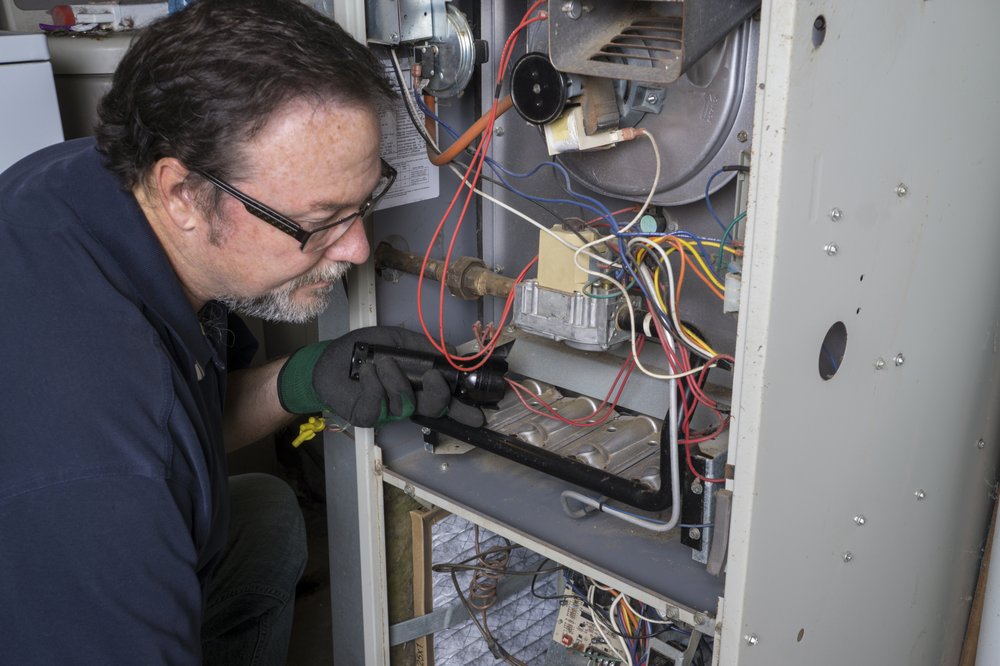 Slide of Service Tech Plumbing Heating &Cooling