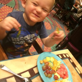 Goofy's Kitchen - Happy baby with a plate full of fruit - American Near Me - Anaheim, California