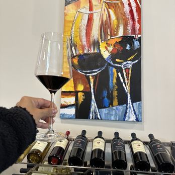 Jean Edwards Cellars - a hand holding a glass of wine - Wine Tasting Room Near Me - Napa, California