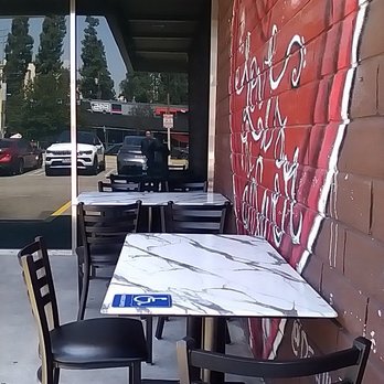 Joe's Pizza Studio City - Outside seating with couple of tables and chairs.. - Italian Near Me - Studio City, California