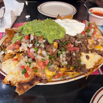El Farolito - Nachos Supreme. This plate of nachos can be an appetizer for four people; or a full-on meal for two. - Mexican Near Me - Placentia, California El Farolito - Nachos Supreme. This plate of nachos can be an appetizer for four people; or a full-on meal for two. - Mexican Near Me - Placentia, California