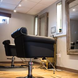 Red Bird Salon - Our Design Floor has equal amounts of professionalism and comfortability with our relaxing styling chairs and large crackled floor mirrors.