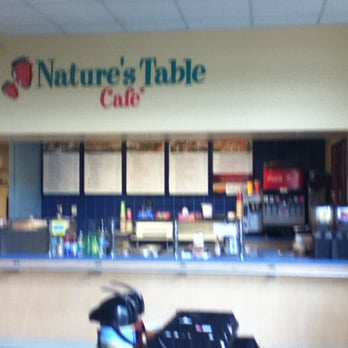 Nature's Table - a motorcycle parked in front of a cafe - Cafes Near Me - St. Petersburg, Florida