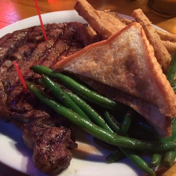 Leon's Steakhouse & Saloon - Angus ribeye with grilled green beans and home-style fries - Steakhouses Near Me - Longview, Texas Leon's Steakhouse & Saloon - Angus ribeye with grilled green beans and home-style fries - Steakhouses Near Me - Longview, Texas