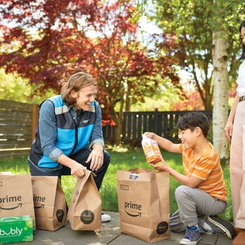 Amazon Fresh Grocery Delivery - a woman and a boy with packages - Grocery Near Me