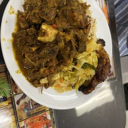Curry goat over rice