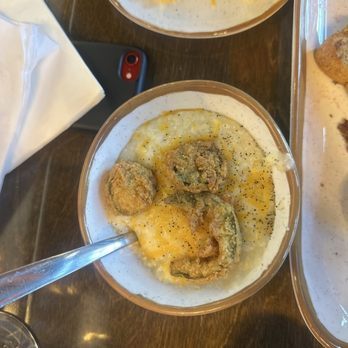 Brunches - Loaded grits: served with cheese, fried jalapeños and was supposed to have bacon on there. - Breakfast & Brunch Near Me - Cary, North Carolina Brunches - Loaded grits: served with cheese, fried jalapeños and was supposed to have bacon on there. - Breakfast & Brunch Near Me - Cary, North Carolina