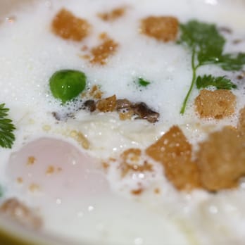 FIG - Coddled farm egg with jumbo lump crab, celeriac cream, morels and english peas - New American Near Me - Charleston, South Carolina FIG - Coddled farm egg with jumbo lump crab, celeriac cream, morels and english peas - New American Near Me - Charleston, South Carolina