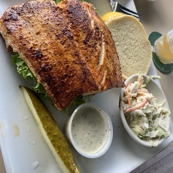 Riverside Cafe - Giant Jake Owen mahi sandwich w slaw. House made tarter - Sports Bars Near Me - Vero Beach, Florida