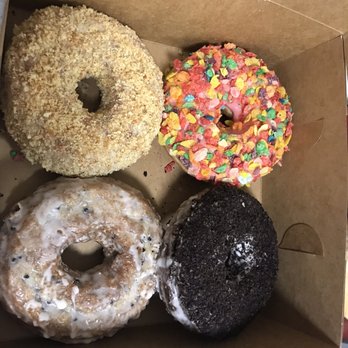 Davis Square Hand Crafted Donuts & Bagels - Butternut crunch cake donut, Oreo cake donut, glazed Blueberry Old Fashioned Glazed, Fruity Pebbles - Donuts Near Me - Somerville, Massachusetts
