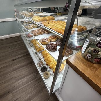 ST Donuts - a display case filled with various types of donuts - Donuts Near Me - San Antonio, Texas ST Donuts - a display case filled with various types of donuts - Donuts Near Me - San Antonio, Texas