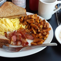 eggs, toast, bacon, hash browns, and sweet potatoes