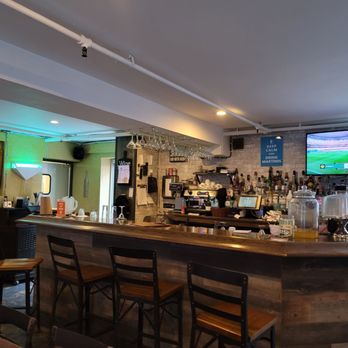 The Inkan - a bar with chairs and a television - Peruvian Near Me - Long Island City, New York