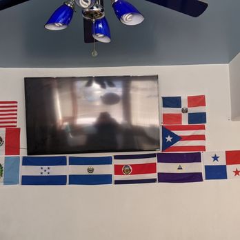 El Salvador Restaurant - a flat screen television with flags on the wall - Latin American Near Me - Milwaukee, Wisconsin El Salvador Restaurant - a flat screen television with flags on the wall - Latin American Near Me - Milwaukee, Wisconsin
