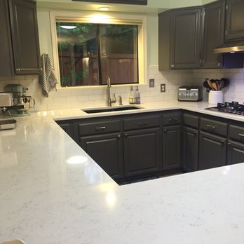 Fairy White Quartz Counters With White Subway Tile And Light Gray