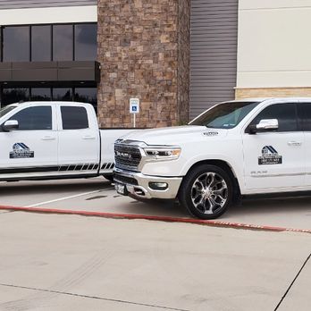 BEST Contracting Services - two trucks parked in front of a building - Roofing Near Me - Frisco, Texas