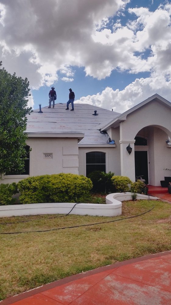 Slide of Mando’s Roofing & Construction