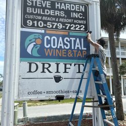 Coastal Wine and Tap - Our new logo on the street sign