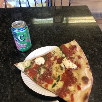 The Pizza Pit - a slice of pizza on a paper plate - Pizza Near Me - Sloatsburg, New York The Pizza Pit - a slice of pizza on a paper plate - Pizza Near Me - Sloatsburg, New York