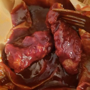 Wingstop - Gross wings in a puddle of sauce - Chicken Wings Near Me - Palmdale, California Wingstop - Gross wings in a puddle of sauce - Chicken Wings Near Me - Palmdale, California