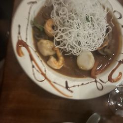 Seafood platter with shrimp, scallops, and special sauce don't quite remember the name