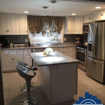 Rosario Construction Services - a kitchen with stainless steel appliances - General Contractors Near Me - Lawrence, Massachusetts