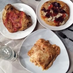 Il Padellino - Clockwise (from top left):  calzone, pizza, and lasagna (mine).  Lasagna is what Anglophones call "le lasagne."