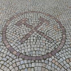 Zabytkowa Kopalnia Sreba - Miner's logo in sidewalk.