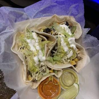 I Love Taco's - a hand holding a taco - Tacos Near Me - Austin, Texas I Love Taco's - a hand holding a taco - Tacos Near Me - Austin, Texas