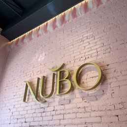 Name of the restaurant on the pink wall