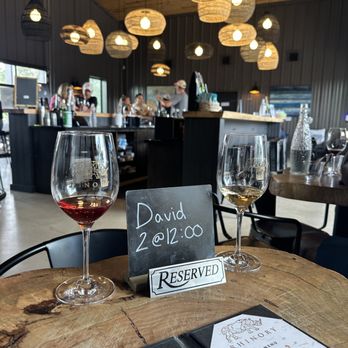 Rhinory - two glasses of wine on a table - Wineries Near Me - Fredericksburg, Texas