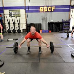 Blackbird CrossFit - Athlete set up to lift a barbell