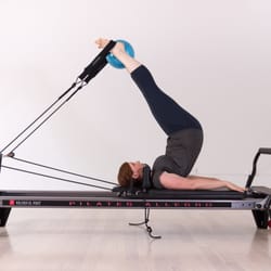 North Movement Studio - The Pilates Reformer- our model is demonstrating short spine which feels awesome and looks great too!