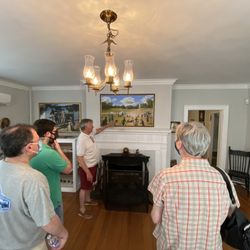 caldwell parsonage - A staff explains to the visitors on the history of the parsonage