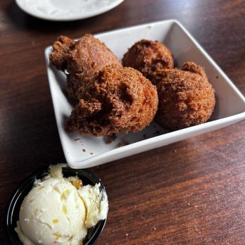 Southern Fried & Sweet Tea - Hush puppies and orange butter. The hushpuppies are more like cake balls rolled in corn meal and deep fried. The orange butter to die for! - Desserts Near Me - Puryear, Tennessee Southern Fried & Sweet Tea - Hush puppies and orange butter. The hushpuppies are more like cake balls rolled in corn meal and deep fried. The orange butter to die for! - Desserts Near Me - Puryear, Tennessee