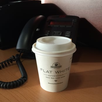 Second Cup - a coffee cup on a desk next to a telephone - Coffee & Tea Near Me - Edmonton, Alberta Second Cup - a coffee cup on a desk next to a telephone - Coffee & Tea Near Me - Edmonton, Alberta