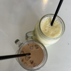 The Bees Knees - Iced Latte and Banana Milkshake in mason jars with paper straws.