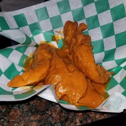 Bj's Mallards - Chicken tenders . Hot sauce. $7 came with blue cheese packets. Supposed to come with celery but did not, neither utensils.