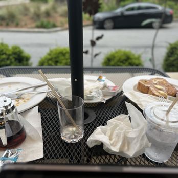 Thumbs Up Diner - Table showing how there was no bussing service. All this mess was left while I was still eating and drinking at the table. - Breakfast & Brunch Near Me - Fayetteville, Georgia